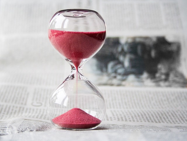 An hourglass with sand running down